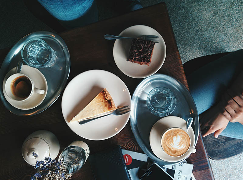 person having coffee and cake
