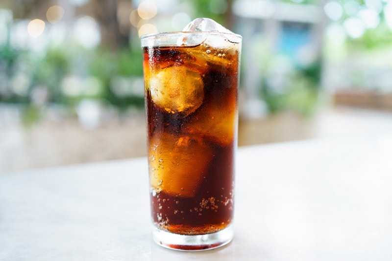 cola soda with ice in a drinking glass