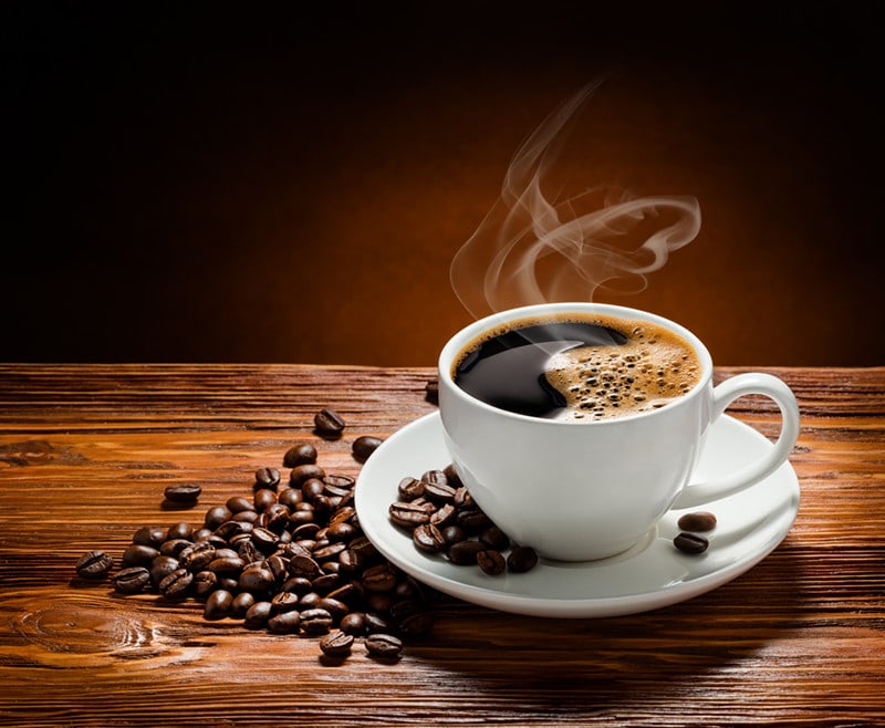 cup of coffee and beans on the table