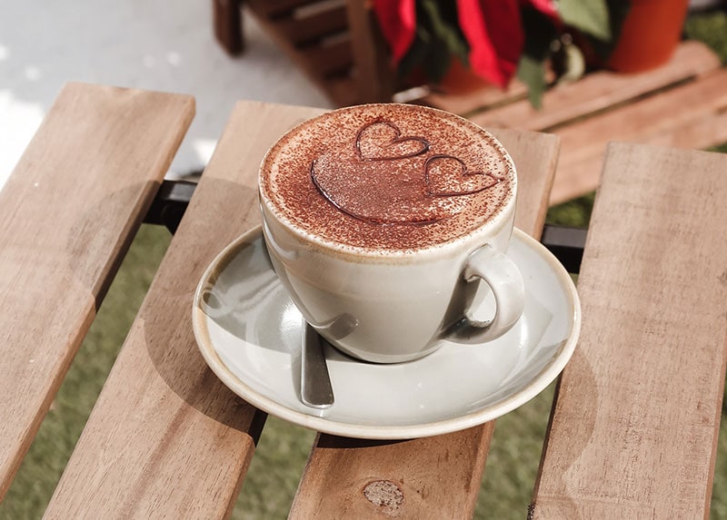 a cup of mocha latte on a saucer