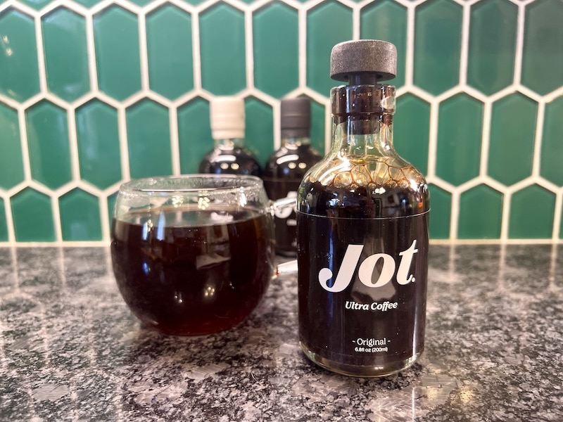Jot Ultra Coffee Original flavor in bottle with hot coffee