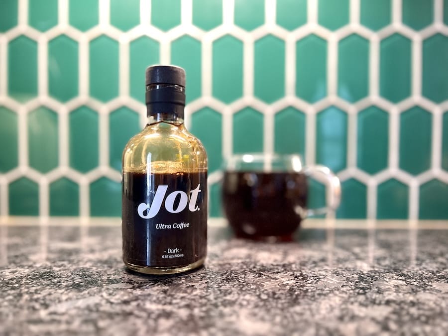 Jot Ultra Coffee dark bottle on counter